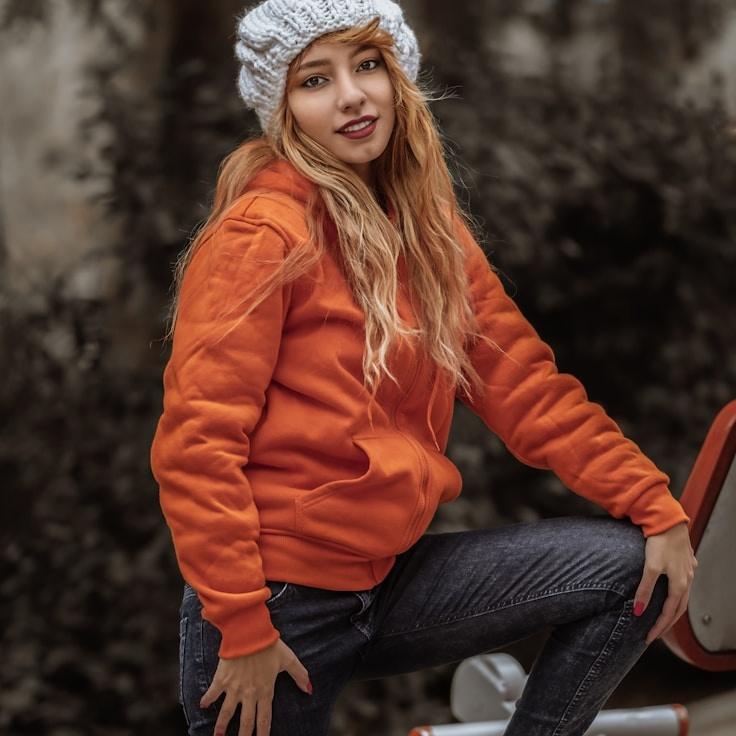 Avery Singh, Lead Design Curator at Ridge Vault Studio, reviewing corporate floral arrangements